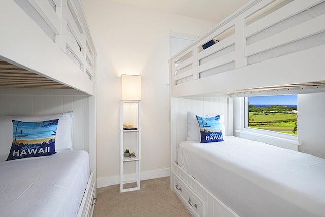2611 Kiahuna Plantation Dr Unit 13B, Koloa, HI 96756 - bedroom with light colored carpet, baseboards, and a towering ceiling