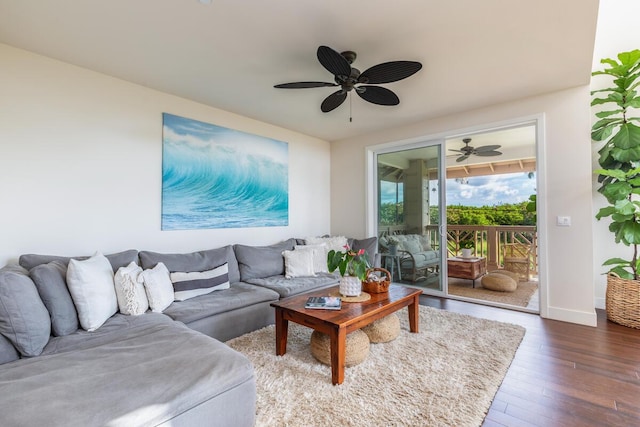 2611 Kiahuna Plantation Dr Unit 4G, Koloa, HI 96756 - living area with dark wood-style floors, ceiling fan, and baseboards