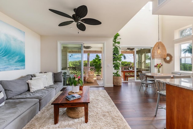 2611 Kiahuna Plantation Dr Unit 4G, Koloa, HI 96756 - living room with a ceiling fan, dark wood-type flooring, and baseboards
