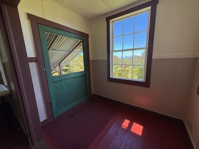 48-5441 Kukuihaele Rd, Honokaa, HI 96727 - doorway featuring wood-type flooring and wainscoting