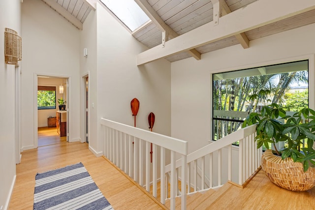 4160 Kalani Pl, Princeville, HI 96722 - hall with a skylight, wood ceiling, an upstairs landing, and wood finished floors