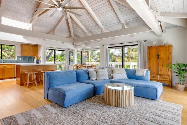 4160 Kalani Pl, Princeville, HI 96722 - living room with wood ceiling with exposed beams, light wood finished floors, ceiling fan, and high vaulted ceiling