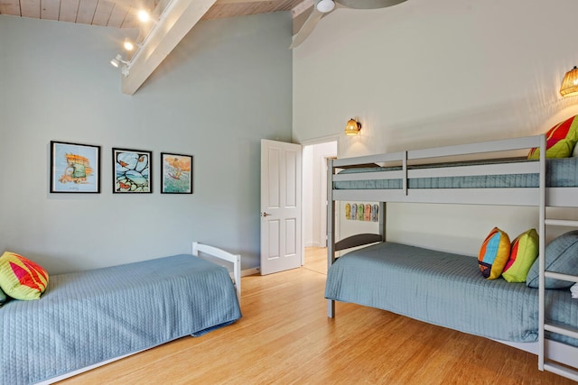 4160 Kalani Pl, Princeville, HI 96722 - bedroom with wood finished floors, wooden ceiling with exposed beams, track lighting, and high vaulted ceiling