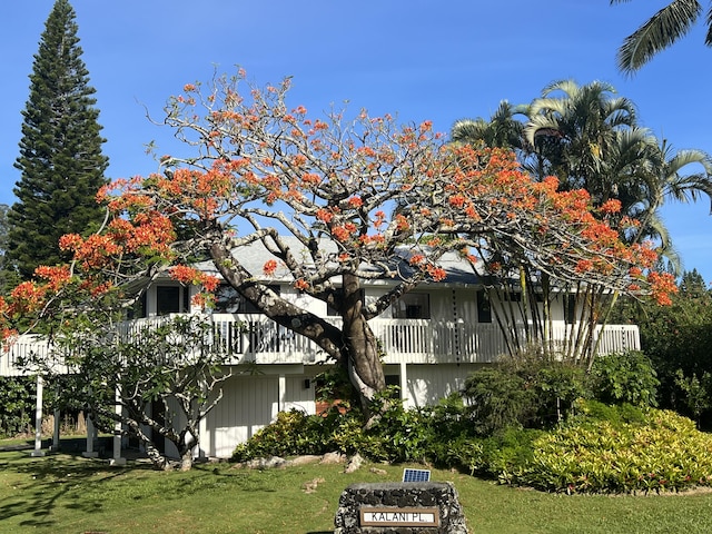 4160 Kalani Pl, Princeville, HI 96722 - view of property exterior with a lawn and a balcony