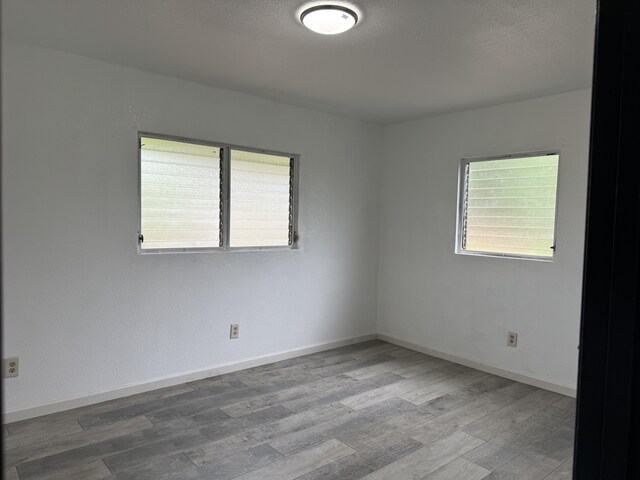 4528-B Hauaala Rd, Kapaa, HI 96746 - spare room with wood finished floors and baseboards