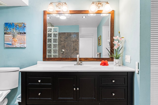 75-6082 Alii Dr Unit B229, Kailua-Kona, HI 96740 - bathroom with toilet, vanity, and tiled shower