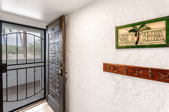 75-6082 Alii Dr Unit B229, Kailua-Kona, HI 96740 - doorway to outside with a textured wall