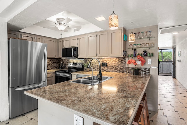 75-6082 Alii Dr Unit B229, Kailua-Kona, HI 96740 - kitchen with stainless steel appliances, a peninsula, a sink, light tile patterned floors, and backsplash