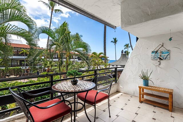 75-6082 Alii Dr Unit B229, Kailua-Kona, HI 96740 - sunroom / solarium with tile patterned floors and a wall of windows