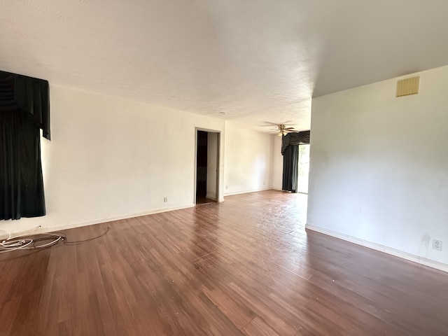 68-1736 Puwalu St, Waikoloa, HI 96738 - spare room with wood finished floors, baseboards, a ceiling fan, and a textured ceiling