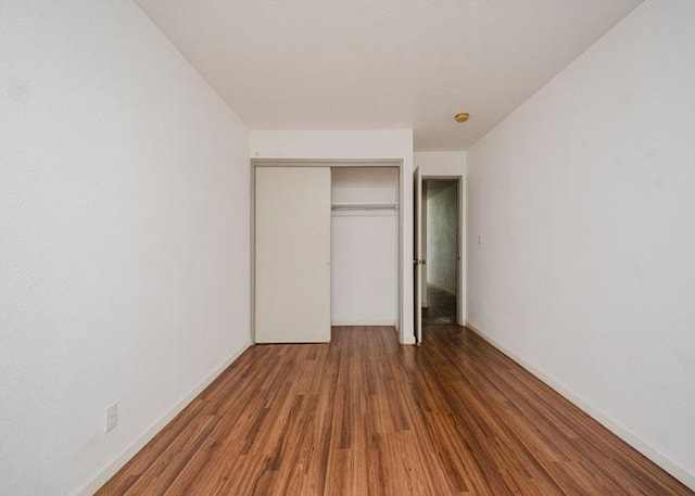 68-1736 Puwalu St, Waikoloa, HI 96738 - unfurnished bedroom featuring a closet, wood finished floors, and baseboards