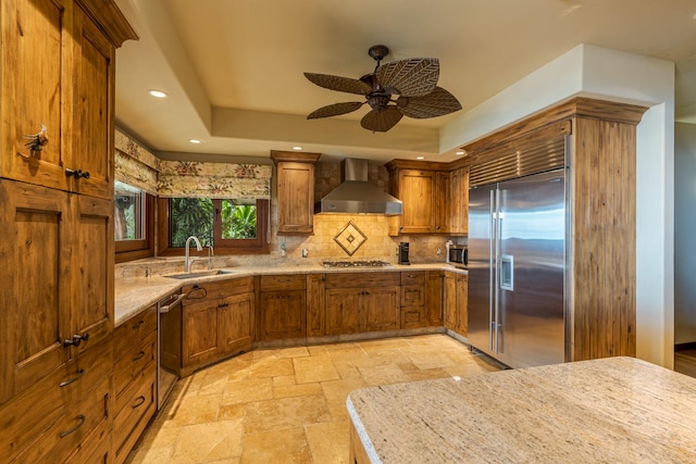 76-863 Pakalakala Pl, Kailua-Kona, HI 96740 - kitchen with stainless steel appliances, wall chimney exhaust hood, brown cabinets, stone tile floors, and recessed lighting