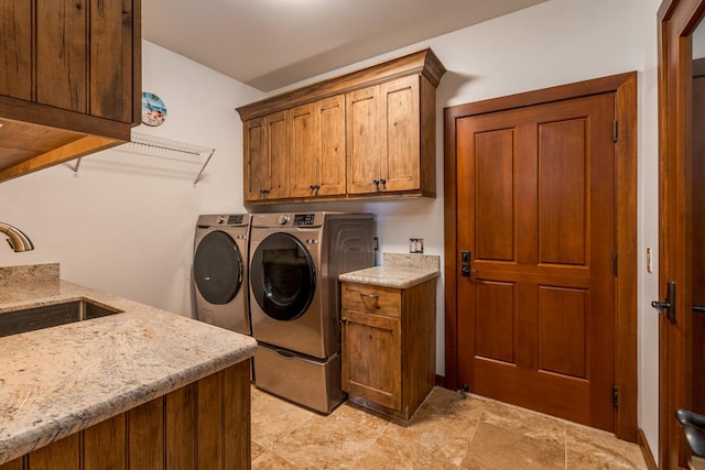 76-863 Pakalakala Pl, Kailua-Kona, HI 96740 - laundry area featuring cabinet space, washing machine and dryer, and light stone finish floors
