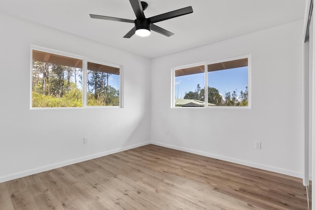 16-2071 Kuhio Dr, Pahoa, HI 96778 - spare room featuring plenty of natural light, wood finished floors, baseboards, and ceiling fan