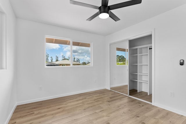 16-2071 Kuhio Dr, Pahoa, HI 96778 - unfurnished bedroom featuring light wood-style flooring, baseboards, a closet, and a ceiling fan