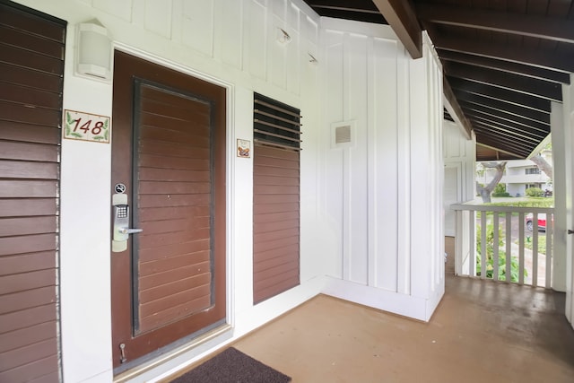 2253 Poipu Rd Unit 148, Koloa, HI 96756 - doorway to property featuring covered porch and board and batten siding