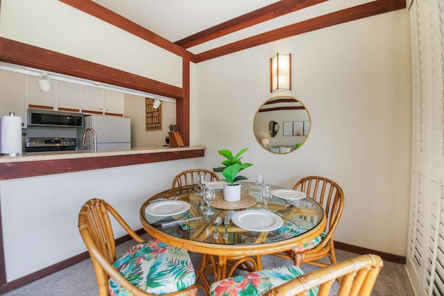 2253 Poipu Rd Unit 148, Koloa, HI 96756 - dining room with carpet and baseboards