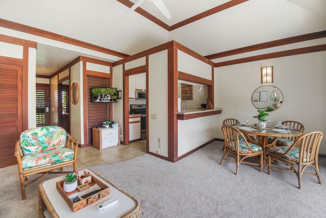 2253 Poipu Rd Unit 148, Koloa, HI 96756 - living area featuring light colored carpet, lofted ceiling, a ceiling fan, and baseboards