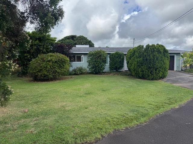 1681 Papau St, Kapaa, HI 96746 - obstructed view of property featuring a front yard