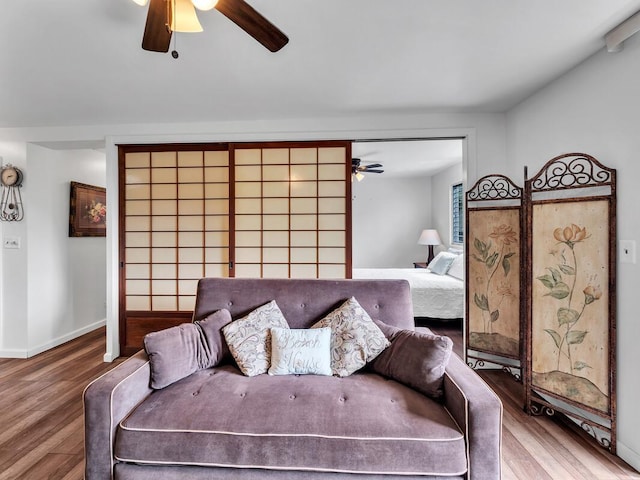 75-5766 Kuakini Hwy Unit 101, Kailua-Kona, HI 96740 - living area with ceiling fan, wood finished floors, and baseboards