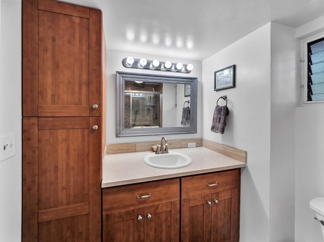 75-5766 Kuakini Hwy Unit 101, Kailua-Kona, HI 96740 - bathroom featuring vanity, toilet, and an enclosed shower
