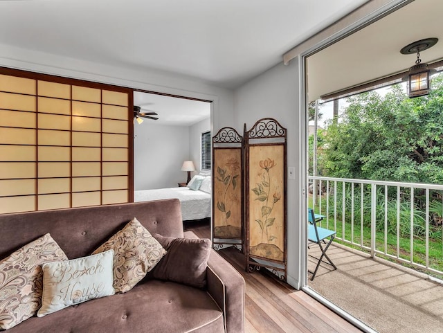 75-5766 Kuakini Hwy Unit 101, Kailua-Kona, HI 96740 - bedroom with wood finished floors and access to exterior