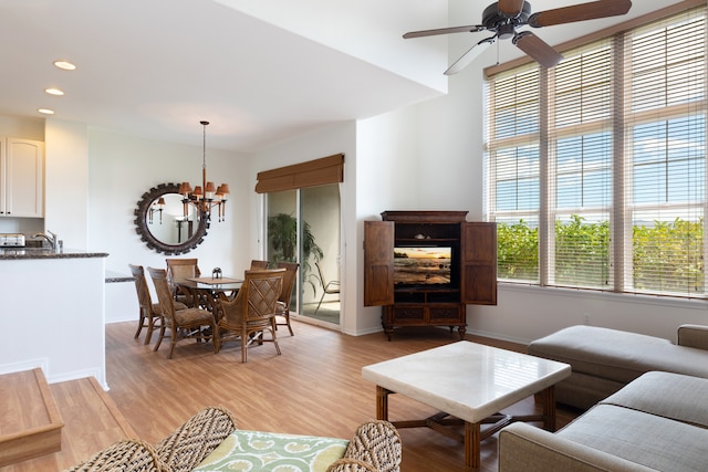 69-555 Waikoloa Beach Dr Unit 1704, Waikoloa, HI 96738 - living area with a chandelier, light wood-type flooring, a ceiling fan, recessed lighting, and baseboards