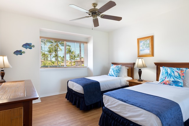 69-555 Waikoloa Beach Dr Unit 1704, Waikoloa, HI 96738 - bedroom with light wood-style floors, baseboards, and ceiling fan