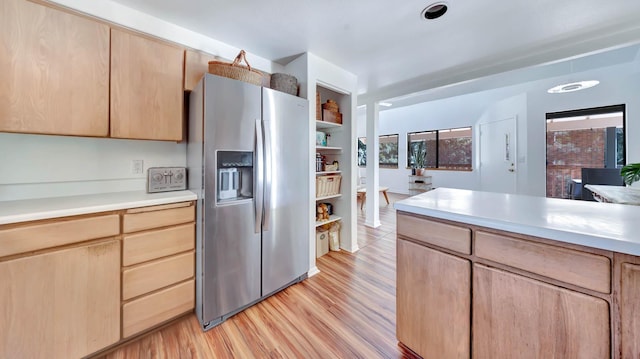 4740 Lae Rd, Kalaheo, HI 96741 - kitchen featuring stainless steel fridge with ice dispenser, light brown cabinetry, light wood-type flooring, and light countertops