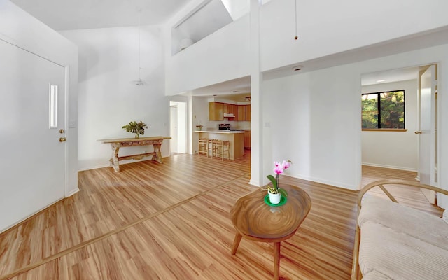 4740 Lae Rd, Kalaheo, HI 96741 - living room with light wood-style flooring, baseboards, and a high ceiling