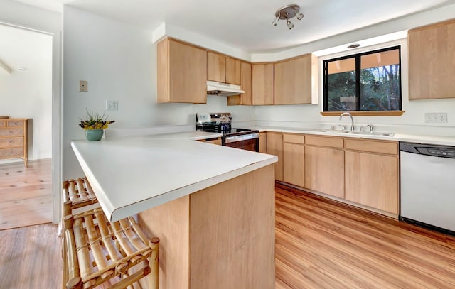 4740 Lae Rd, Kalaheo, HI 96741 - kitchen with dishwasher, stainless steel electric range oven, under cabinet range hood, a sink, and light brown cabinets