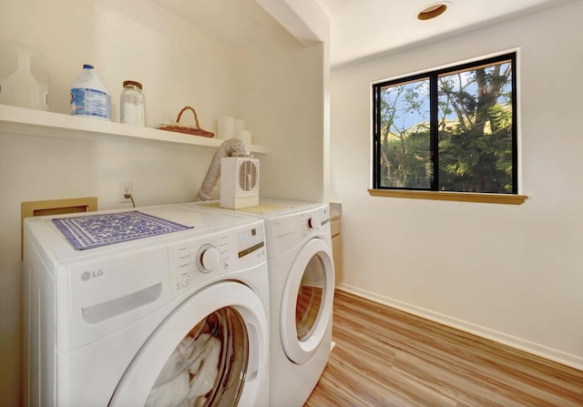 4740 Lae Rd, Kalaheo, HI 96741 - washroom featuring washing machine and clothes dryer, baseboards, and light wood-style floors