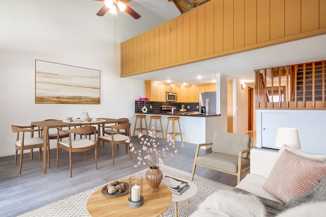 68-3840 Lua Kula St Unit D201, Waikoloa, HI 96738 - living room featuring a high ceiling, a ceiling fan, and light wood-style floors