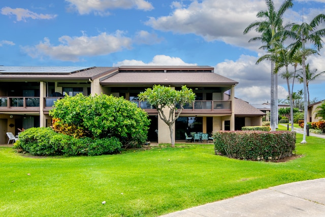 68-3840 Lua Kula St Unit D201, Waikoloa, HI 96738 - rear view of property with a balcony, a yard, stucco siding, and a patio