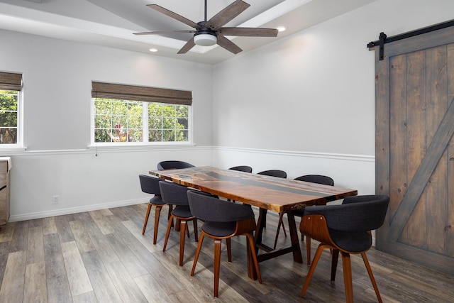 71-1876 Puu Lani Loop, Kailua-Kona, HI 96740 - dining area with a barn door, plenty of natural light, a ceiling fan, wood finished floors, and recessed lighting