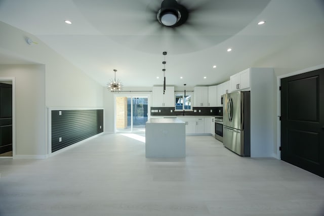 16-2100 Silveroak Dr, Pahoa, HI 96778 - kitchen featuring stainless steel appliances, a kitchen island, lofted ceiling, light wood-style floors, and ceiling fan
