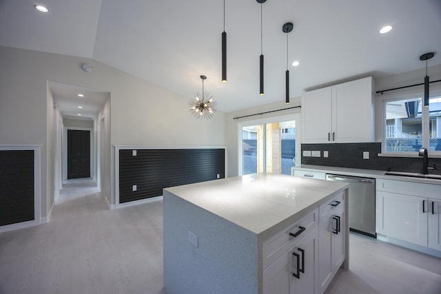 16-2100 Silveroak Dr, Pahoa, HI 96778 - kitchen featuring dishwasher, a sink, light wood-type flooring, vaulted ceiling, and a center island