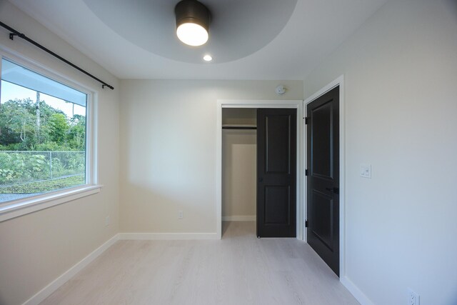 16-2100 Silveroak Dr, Pahoa, HI 96778 - unfurnished bedroom featuring light wood-style floors, baseboards, and a closet