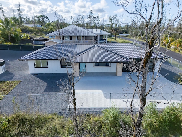 16-2100 Silveroak Dr, Pahoa, HI 96778 - view of front of home with metal roof and driveway