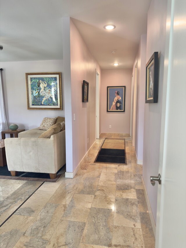 94-5763 Awa Pae Pl, Naalehu, HI 96772 - corridor with baseboards, stone tile floors, and recessed lighting