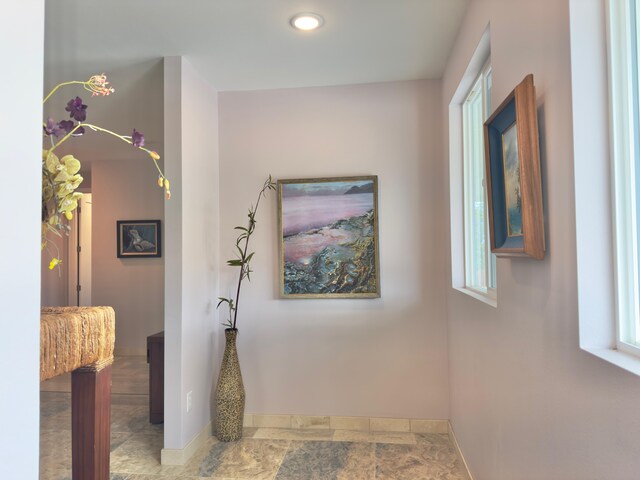 94-5763 Awa Pae Pl, Naalehu, HI 96772 - hall with baseboards, recessed lighting, and stone finish floors