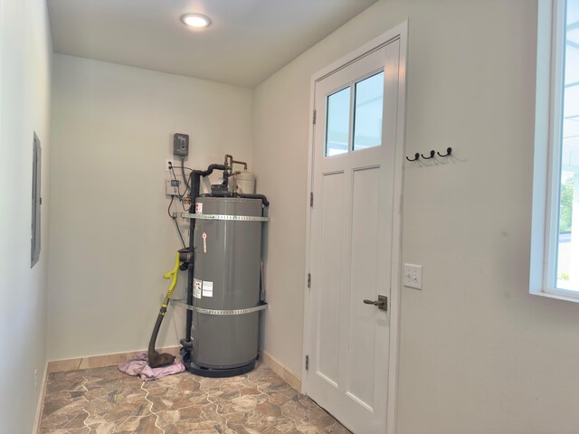 94-5763 Awa Pae Pl, Naalehu, HI 96772 - utility room featuring secured water heater