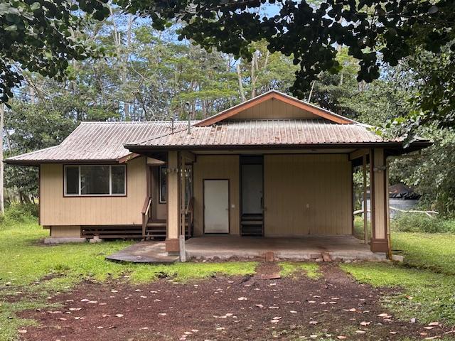 15-1415 14th Ave, Keaau, HI 96749 - view of front of house with metal roof and a carport