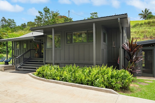 2-3161 Kaumualii Hwy Unit 2, Kalaheo, HI 96741 - view of front of property with board and batten siding and metal roof
