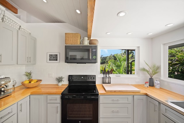 2-3161 Kaumualii Hwy Unit 2, Kalaheo, HI 96741 - kitchen featuring black appliances, butcher block countertops, backsplash, and recessed lighting