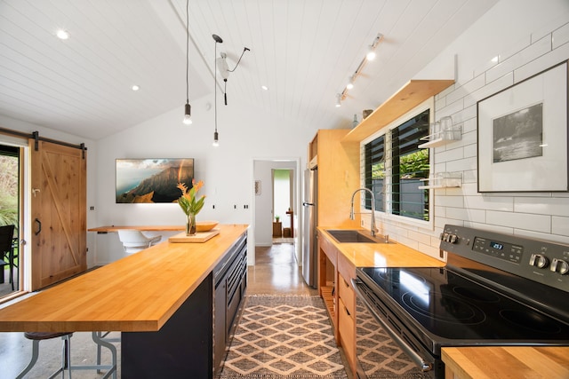 2-3161 Kaumualii Hwy Unit 2, Kalaheo, HI 96741 - kitchen with wooden counters, black range with electric cooktop, vaulted ceiling, a sink, and freestanding refrigerator