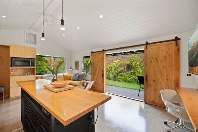 2-3161 Kaumualii Hwy Unit 2, Kalaheo, HI 96741 - dining space with concrete floors, a barn door, recessed lighting, and high vaulted ceiling