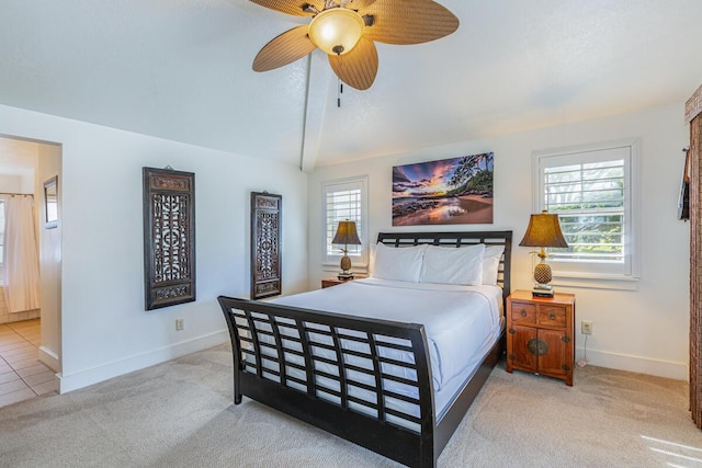 4771 Pepelani Lp Unit 921, Princeville, HI 96722 - bedroom with baseboards, light carpet, lofted ceiling, and a ceiling fan