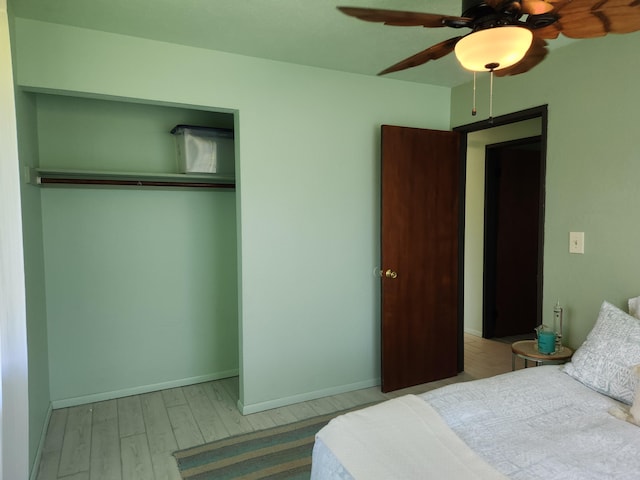 15-2687 Kaku St, Pahoa, HI 96778 - bedroom featuring wood finished floors, a closet, ceiling fan, and baseboards