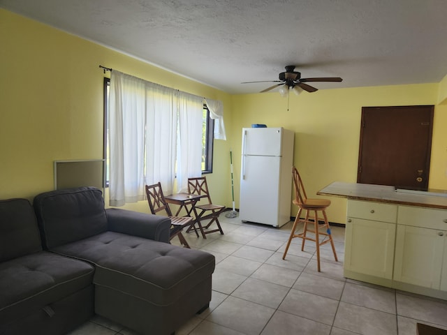 15-2687 Kaku St, Pahoa, HI 96778 - living area with a ceiling fan, a textured ceiling, and light tile patterned floors